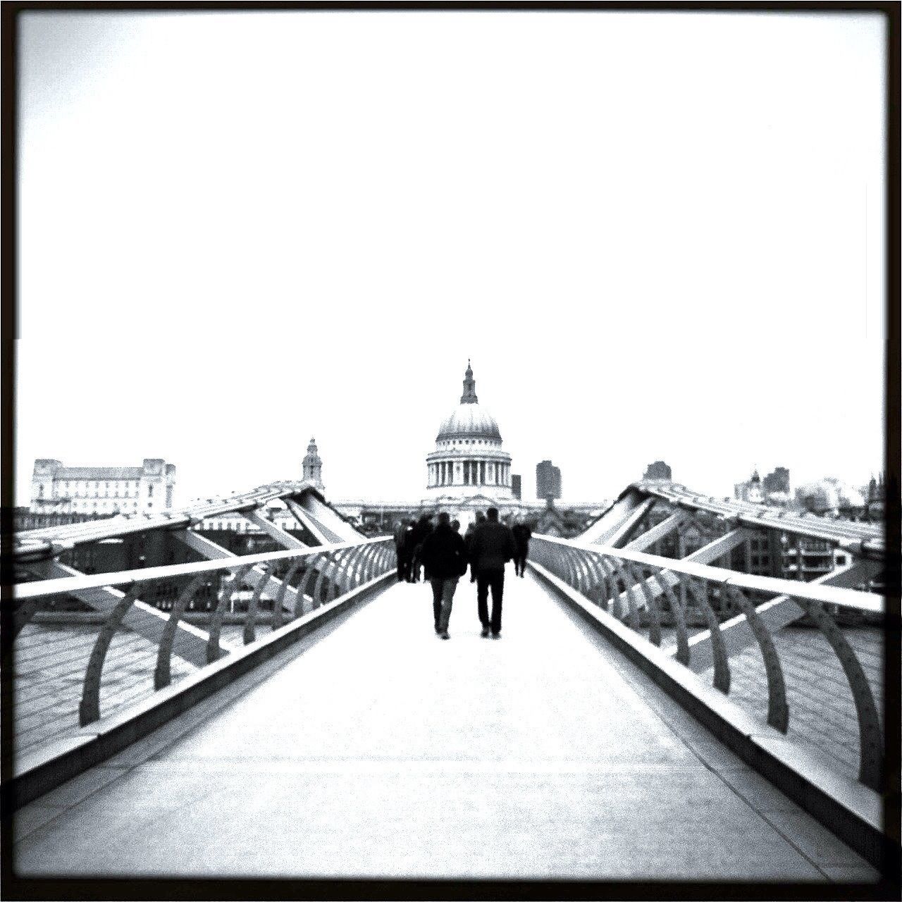 architecture, built structure, men, walking, clear sky, person, building exterior, lifestyles, rear view, copy space, the way forward, large group of people, full length, leisure activity, travel, tourist, travel destinations, tourism, railing