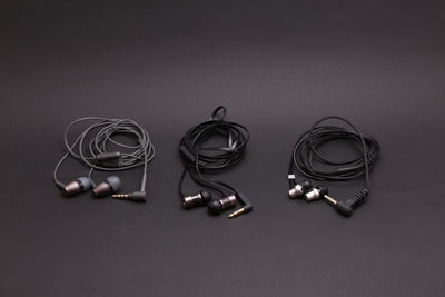 High angle view of in-ear headphones on table