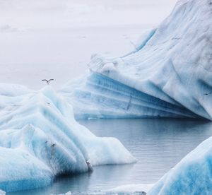 Scenic view of frozen lake against sky