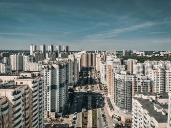 High angle view of buildings in city against sky