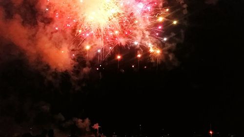 Firework display at night