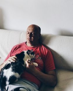 Man relaxing on sofa at home