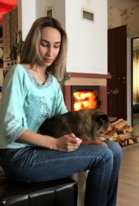 Happy woman sitting in a room