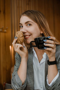 Young woman sitting on table