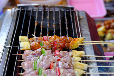 High angle view of meat on barbecue grill