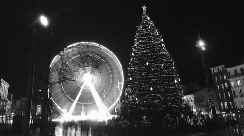 Low angle view of illuminated city at night