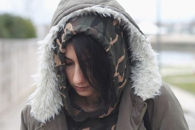 Close-up portrait of a young woman in winter