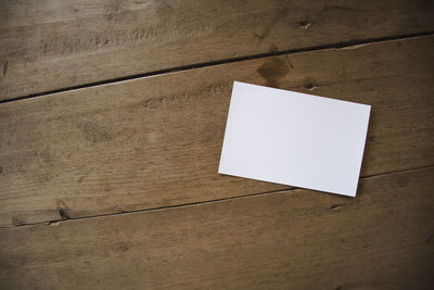 High angle view of paper on table