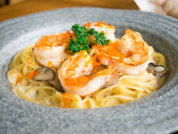 Close-up of prawns and noodles in bowl