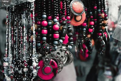 Close-up of necklaces for sale at street market