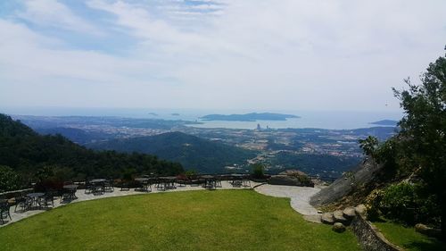 Scenic view of landscape against cloudy sky