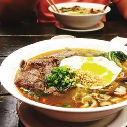 Close-up of soup served in bowl on table