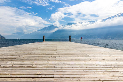 Pier over sea against sky