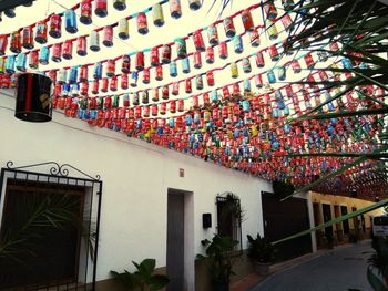 Low angle view of multi colored houses against building