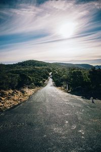 Road amidst landscape against sky