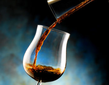 Close-up of wineglass on glass