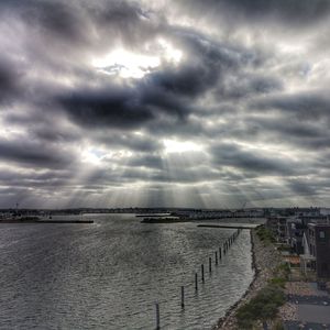 Scenic view of sea against cloudy sky
