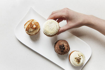 High angle view of hand holding ice cream