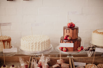 Red cake on table against wall