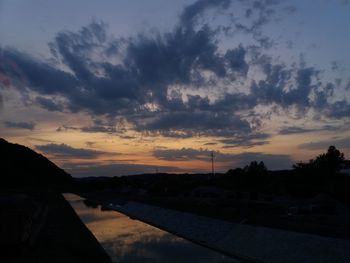 Scenic view of silhouette landscape against sky at sunset