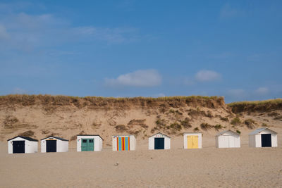 Beach huts against blue sky