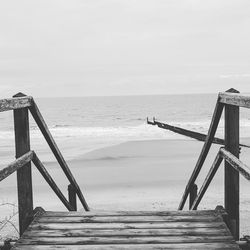 Stairway at beach against sky