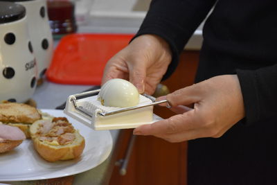 Close-up of hand holding ice cream