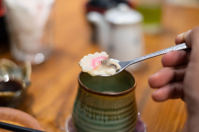 Close-up of hand holding ice cream