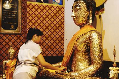 Low angle view of statue of buddha at temple