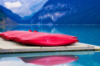 Red boat moored in swimming pool