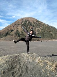 Full length of man on land against sky