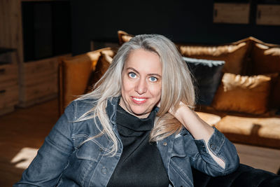 Pensive woman with platinum blonde hair