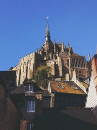 Low angle view of cathedral against blue sky