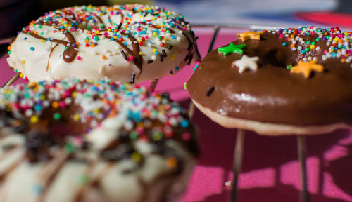 Close-up of donut against pink background 