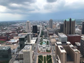 High angle view of modern buildings in city against sky