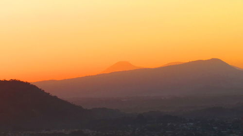 Scenic view of mountains at sunset