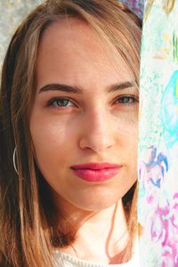 Close-up portrait of a smiling young woman