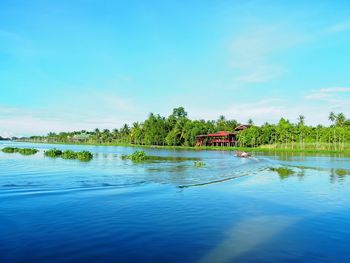 Scenic view of lake against blue sky