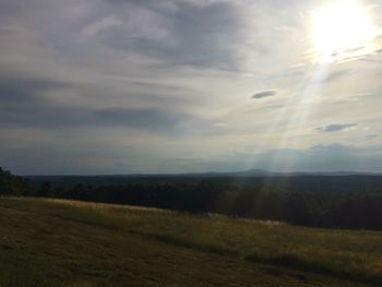 Scenic view of landscape against cloudy sky