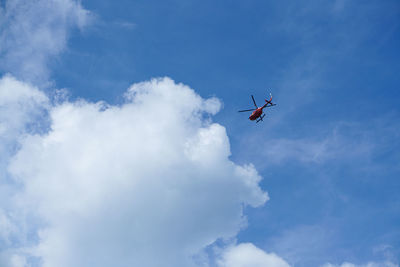 Low angle view of airplane flying in sky