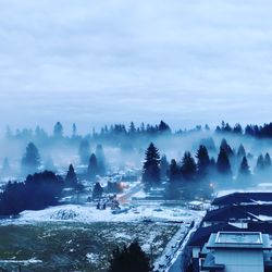 Panoramic shot of townscape against sky during winter