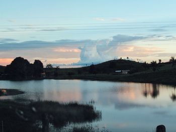 Scenic view of lake at sunset