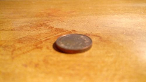 Close-up of coins on table