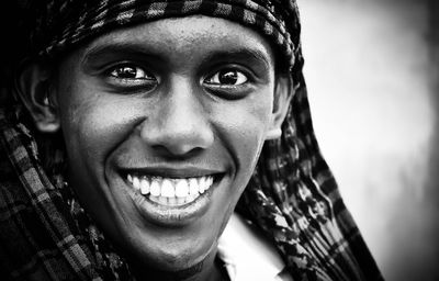 Close-up portrait of smiling young man