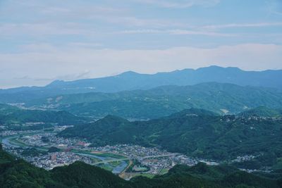 Aerial view of townscape against sky