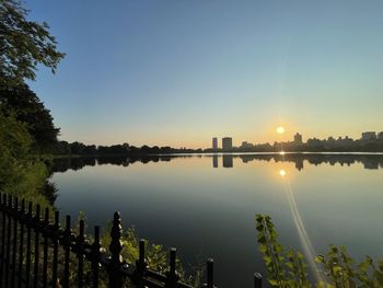 Scenic view of lake against sky during sunset