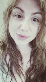 Close-up portrait of smiling young woman