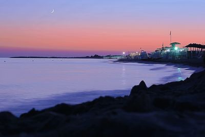 Scenic view of sea against sky at sunset