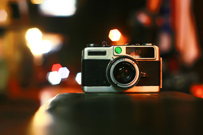 Close-up of camera on table