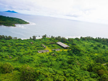 High angle view of sea and trees against sky